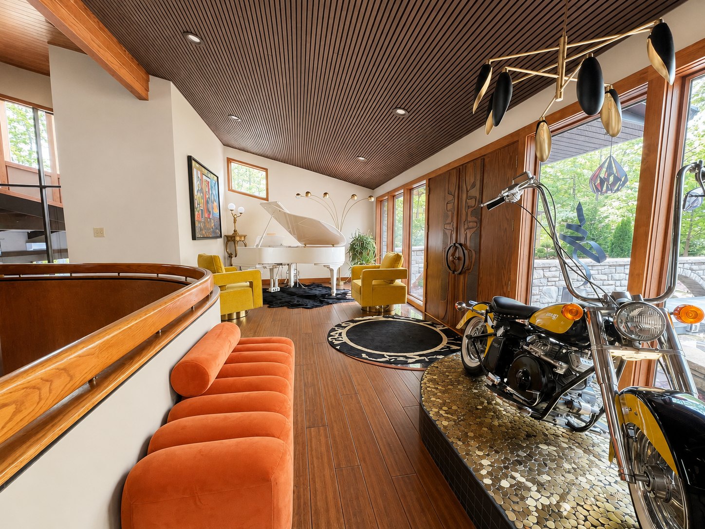 After remodeling: open living area with wood ceiling, grand piano, contemporary seating and motorcycle display